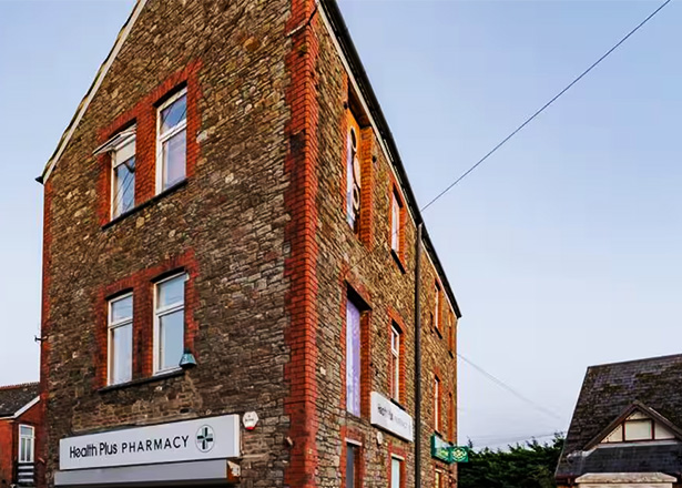 modern living room with a TV and artwork on the wall featuring a cozy couch and a desk charming interior design