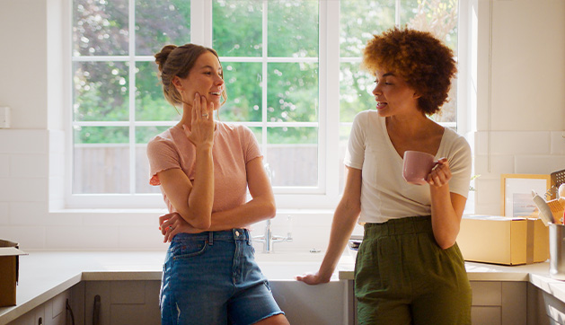 modern kitchen with black cabinets microwave and sleek design spacious area for cooking