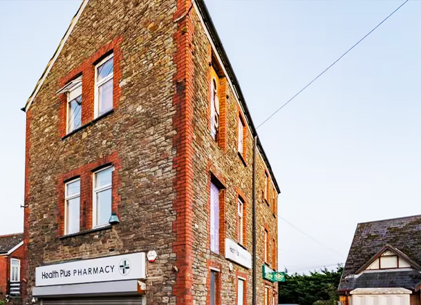 cozy bed with white pillows and soft linens near window with shutters